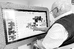 Man doing a jigsaw on big screen