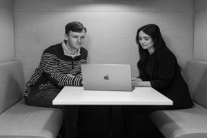 two people on apple mac